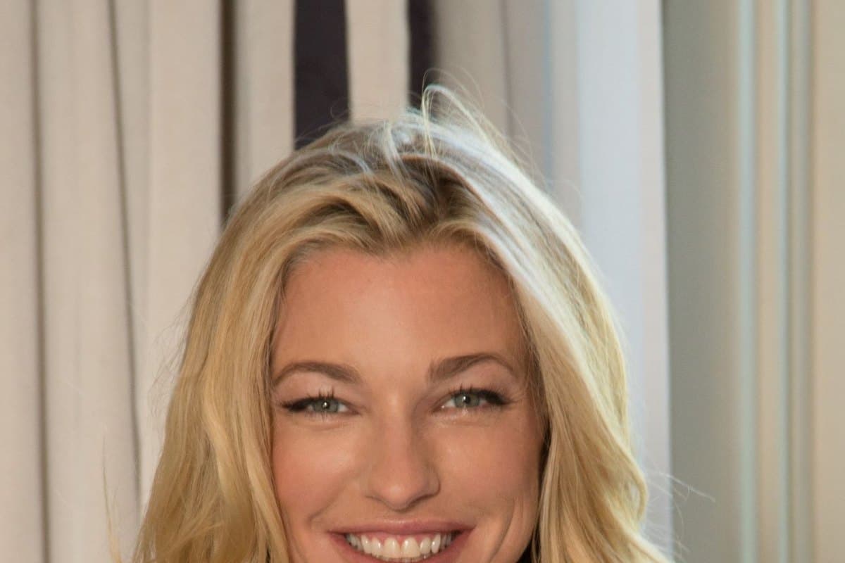 Nicole Junkerman smiling warmly against a soft, light-filled background